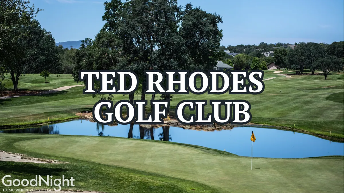 A scenic golf course complete with a pond, lush trees, and the flag on the green. The tranquil setting captures the leisurely side of Nashville, offering a glimpse of outdoor recreation just minutes away from the neighborhood.