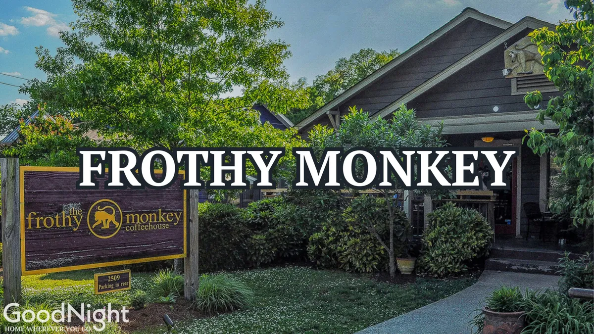 The inviting entrance of a local coffeehouse, featuring the coffeehouse sign, steps leading up, and well-maintained greenery. The atmosphere is welcoming, suggesting a place to relax, meet with friends, or enjoy a coffee before more neighborhood adventures.