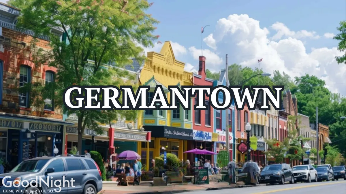 A lively street in Germantown lined with colorful storefronts, people shopping and dining, and lush greenery in the background. The scene captures the vibrancy and charm of the neighborhood, showcasing the appeal of exploring local boutiques and enjoying outdoor dining experiences.