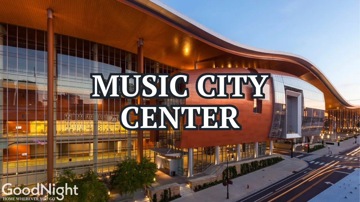 The exterior of the Music City Center building, framed by bustling sidewalks and vibrant green landscaping, represents Nashville’s downtown energy and proximity to major event venues. The modern architecture and street-level activity capture the business travel aspect alluded to in the section.