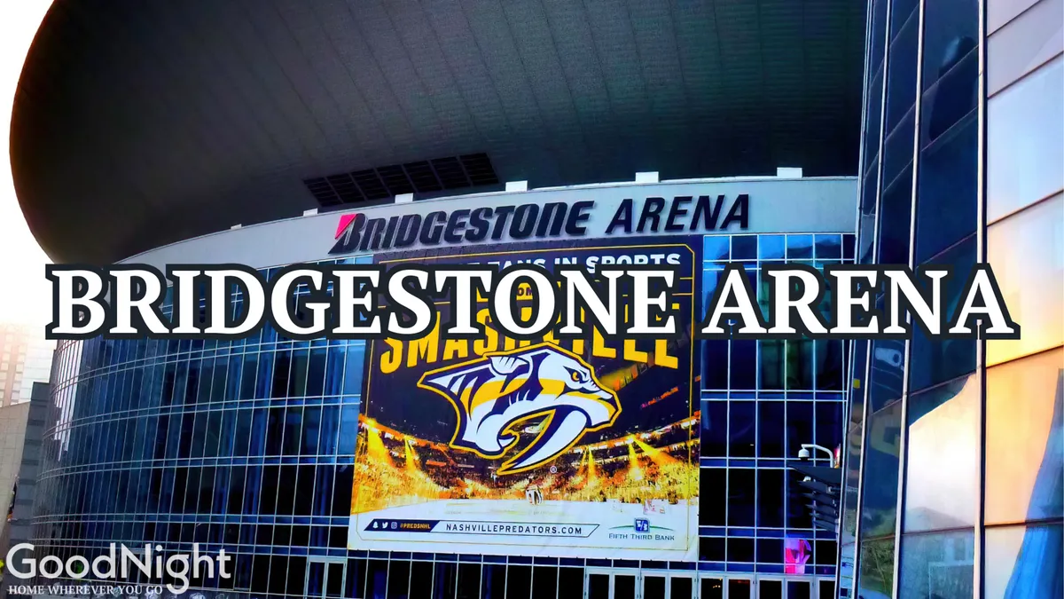 The glass facade of Bridgestone Arena, with its prominent signage and a Nashville Predators banner, anchors the view. The arena buzzes with anticipation, representing a hub for concerts and sporting events just steps away from the action.
